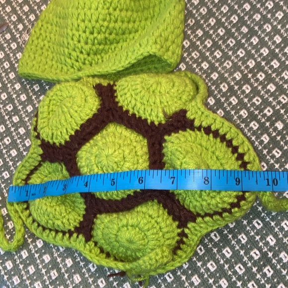 Bundle up baby in handmade turtle costume of knit hat attached to tortoise shell - Picture 6 of 8